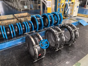 DN600 PN16 nuclear grade rubber expansion joint with EPDM bellows and S2205 duplex stainless steel flanges and limit rods for seawater cooling circuits.