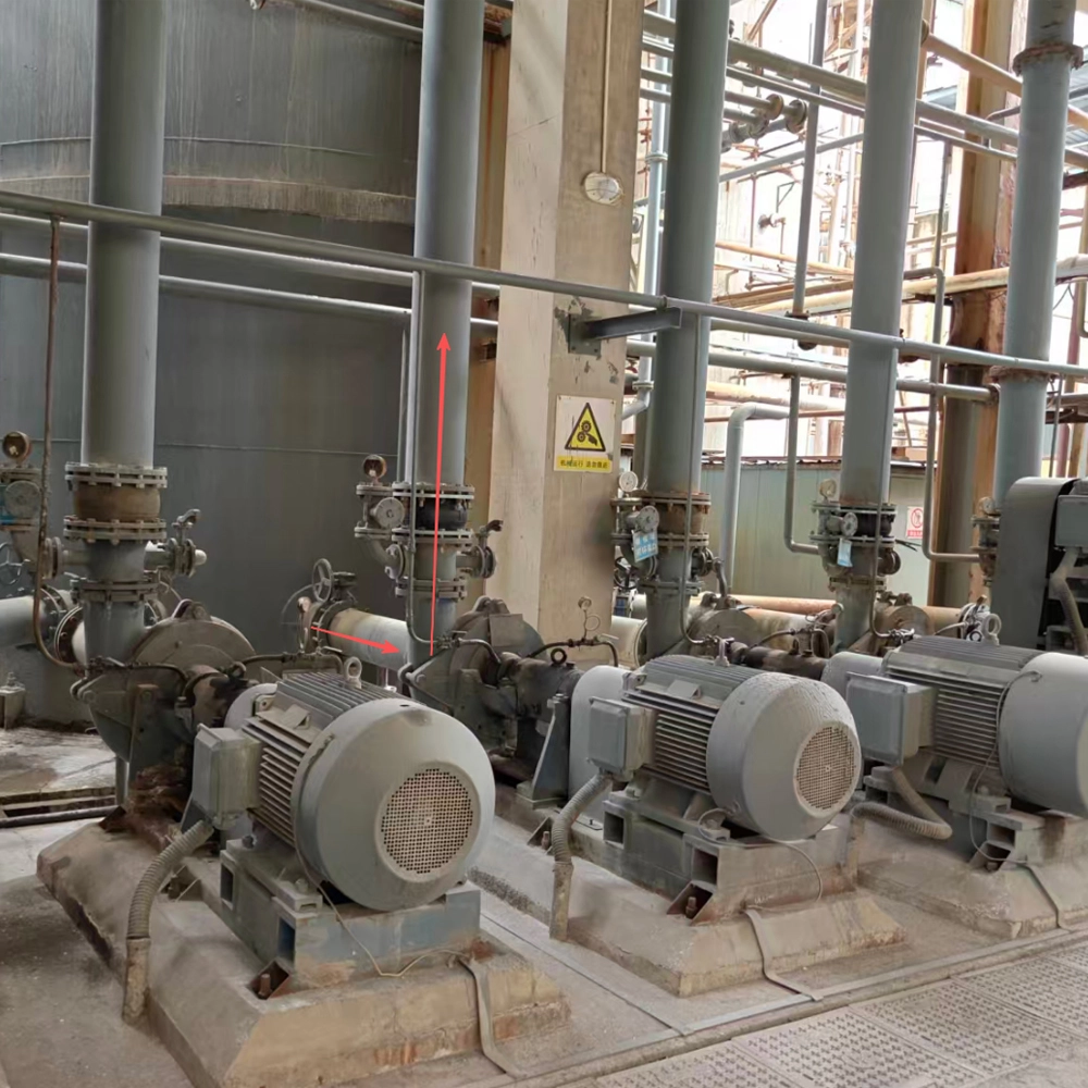 Industrial water pumps and rubber expansion joint installed on carbon steel PE lined piping system in coal-fired power plant FGD system