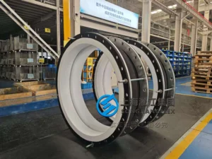 Hand-built DN1200 single-arch Hypalon rubber compensator with a white internal PTFE liner, vacuum support ring, full face sealing profile, galvanized carbon steel flanges, and an integral control unit rod system - 03.