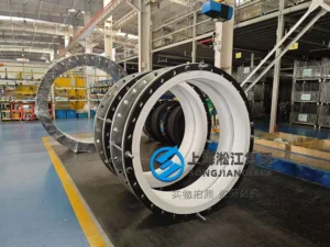 Hand-built DN1200 single-arch Hypalon rubber compensator with a white internal PTFE liner, vacuum support ring, full face sealing profile, galvanized carbon steel flanges, and an integral control unit rod system - 04.